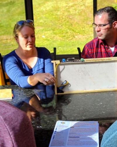 Cornell doctoral candidates Hailey Scofield, center left, and Nathan Oakes, founders of Combplex